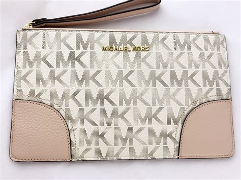 michael kors wrist wallet women pink|Michael Kors small pink wallet.